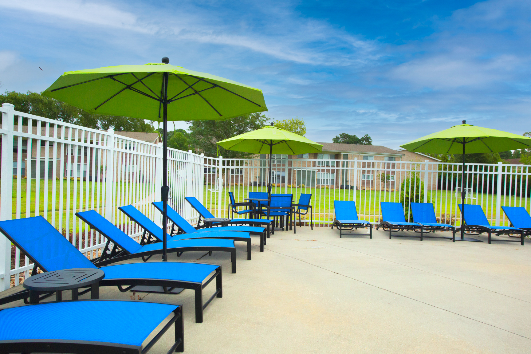 Blue lounge chairs and patio umbrellas