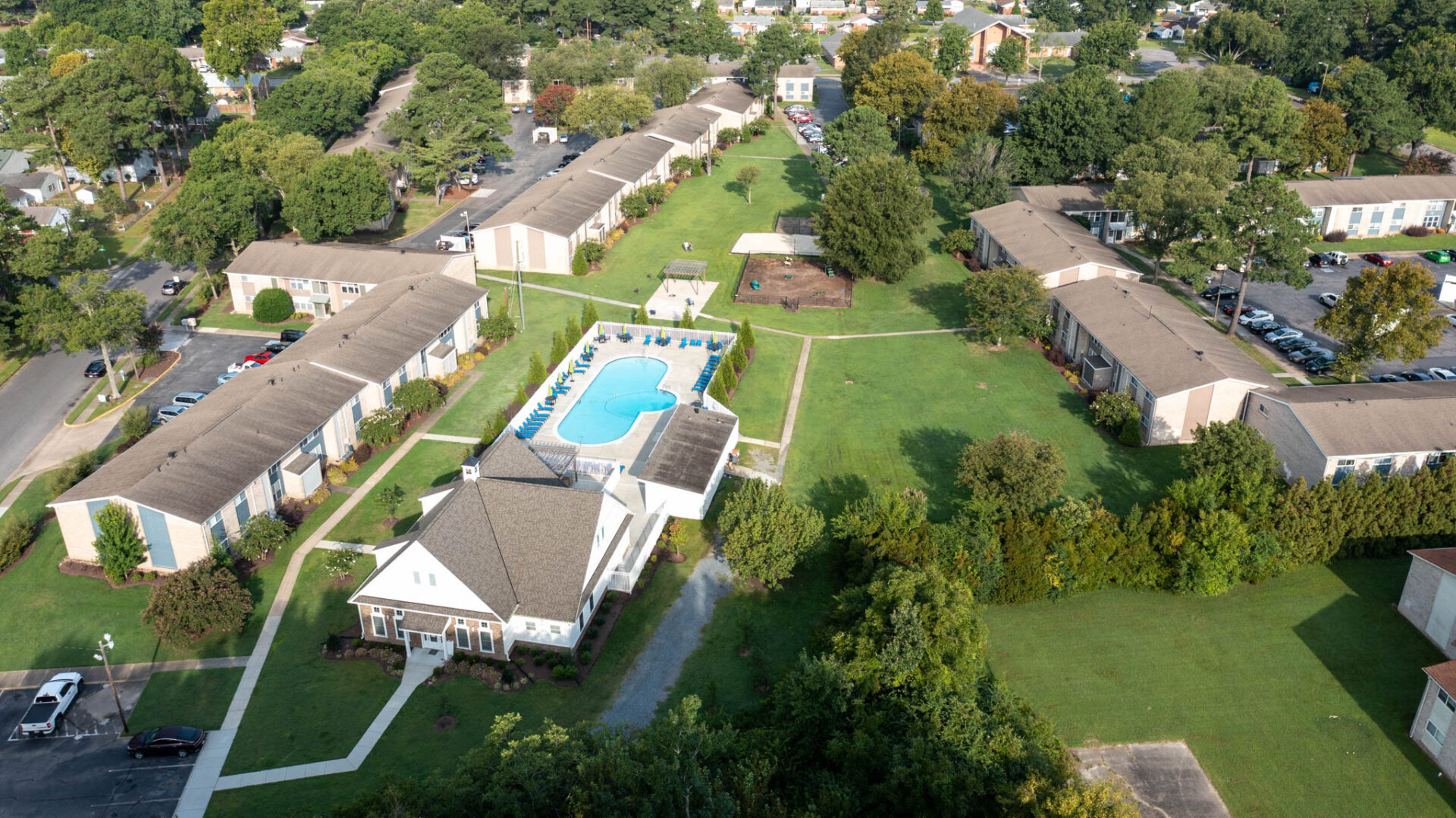aerial view of apartment complex with pool